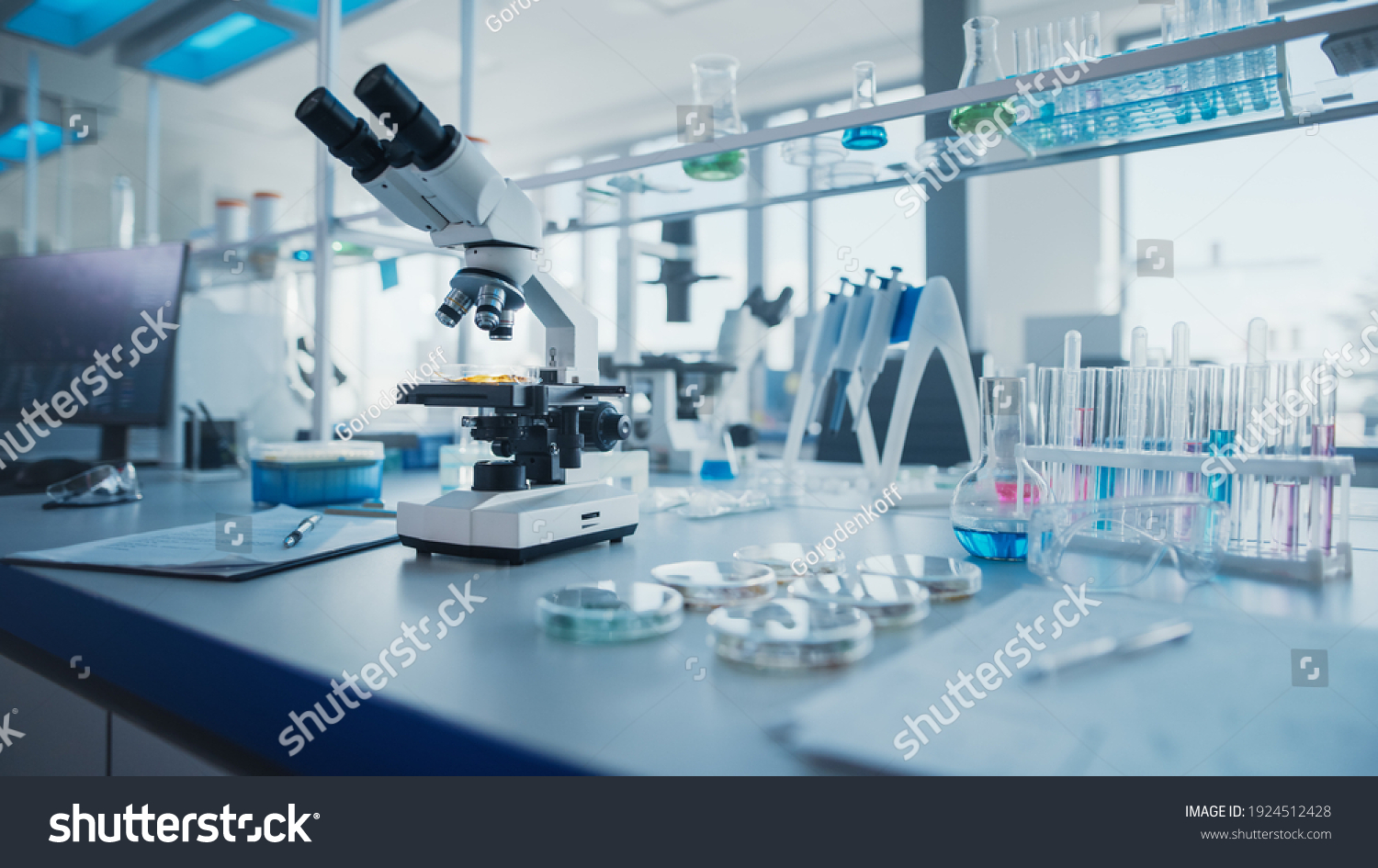 stock-photo-modern-medical-research-laboratory-with-microscope-and-test-tubes-with-biochemicals-on-the-desk-1924512428